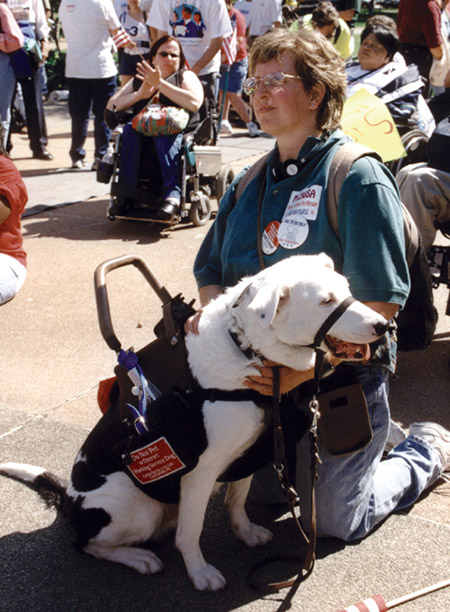 Lady with service animal at crowded event