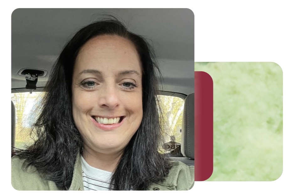 Danielle smiling in a car selfie.