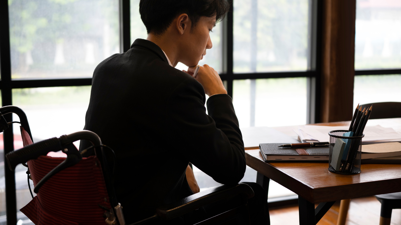 person using a wheelchair sits at a table