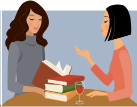 Image of two woman sitting together discussing something.