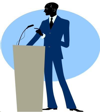 Image of a speaker behind a podium.