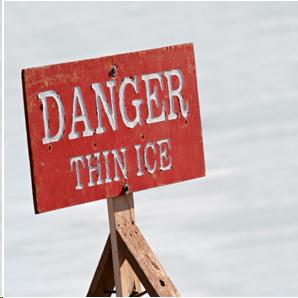 Photograph of a sign that reads "Danger: Thin Ice."