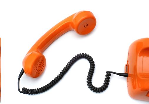 Photograph of an orange telephone receiver.