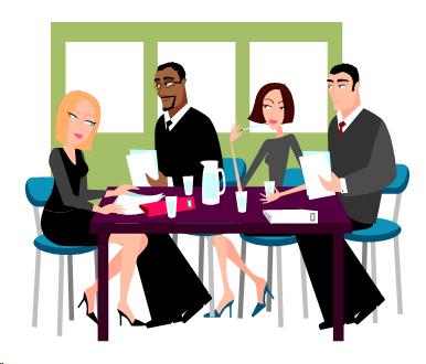 Image of four co-workers sitting an a table together.