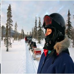 Photograph of someone outside in snow, bundled up in warm clothes.